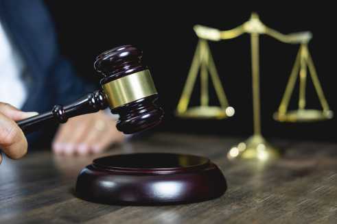 wooden gavel on desk